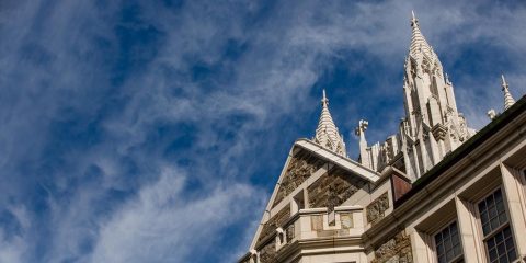 Gasson Hall tower against blue sky