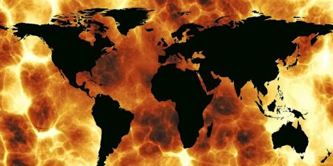 Image showing map of the world amid flames