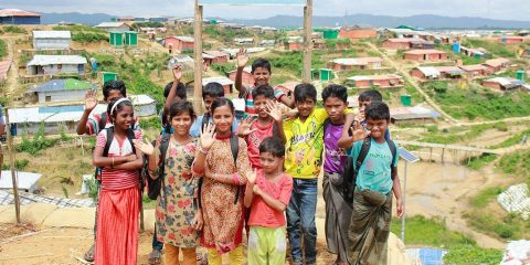 A group of children waving