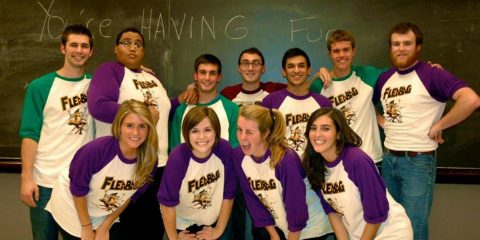 A group of improv actors posing for a photo