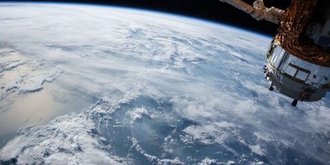 A view of Earth and the International Space Station from outer space