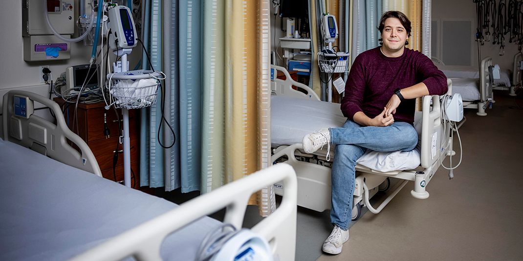 Cameron Howe sitting on a hospital bed