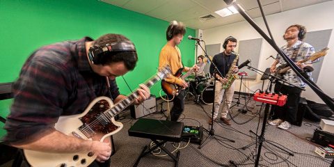 A band playing in a green room