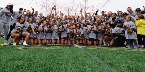 WLAX teams with championship trophy