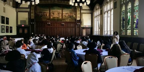 Students listening to a keynote address