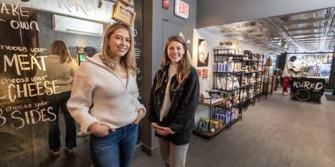 Kured founders inside their store