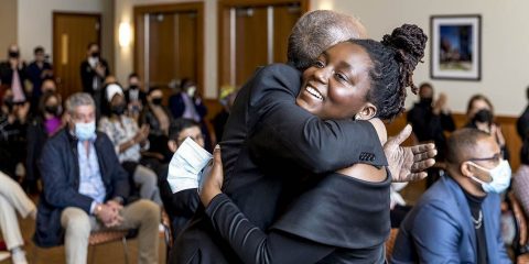 MLK Scholarship winner Kudzai Kapurura hugging someone