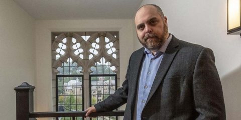 Matt Sienkiewicz standing outside his office