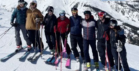 students skiing on a mountain