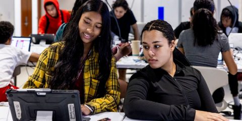 students looking at a laptop