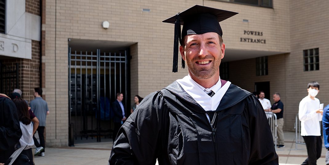 Brooks Orpik wearing a graduation cap and gown