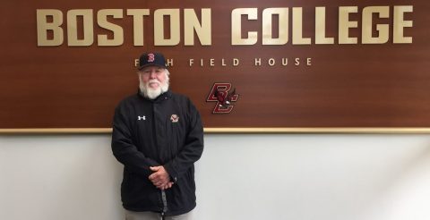 Paul Gallivan in front of a Boston College sign