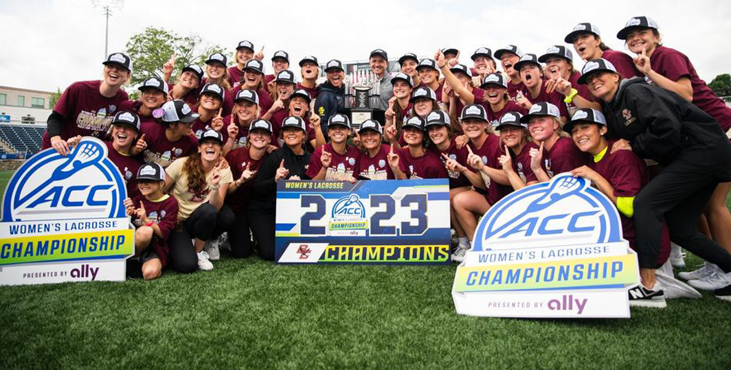 BC Women's Lax with championship banner