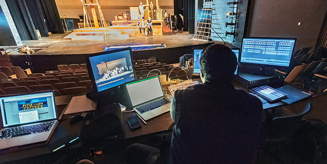 Samuel Biondolillo checks the lighting levels