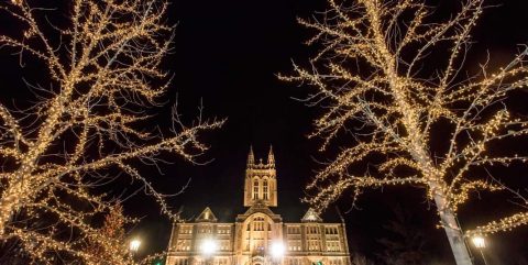 Gasson Hall and trees with holiday lights