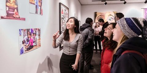 A group of people looking at art