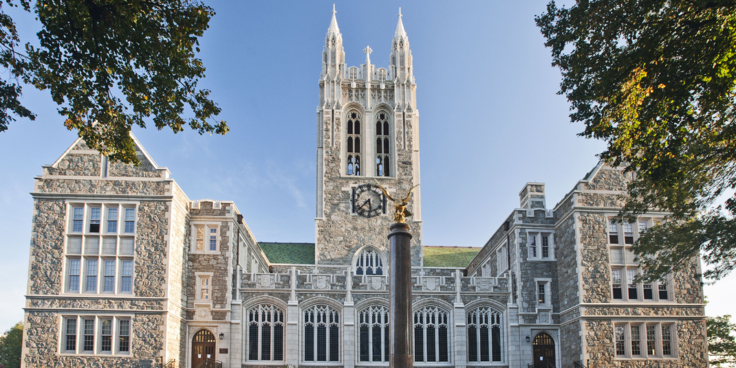 Gasson Hall with green trees in the foreground