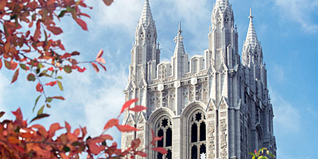 Gasson hall with fall leaves in the foreground