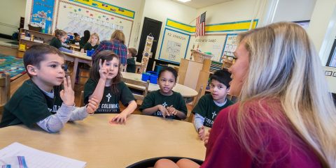 Lynch School student with St. Columbkille class