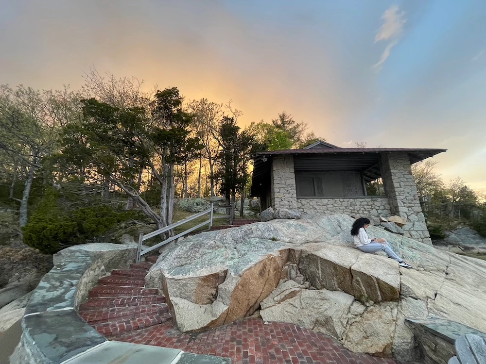 A student reflecting at the Study by the Sea retreat.