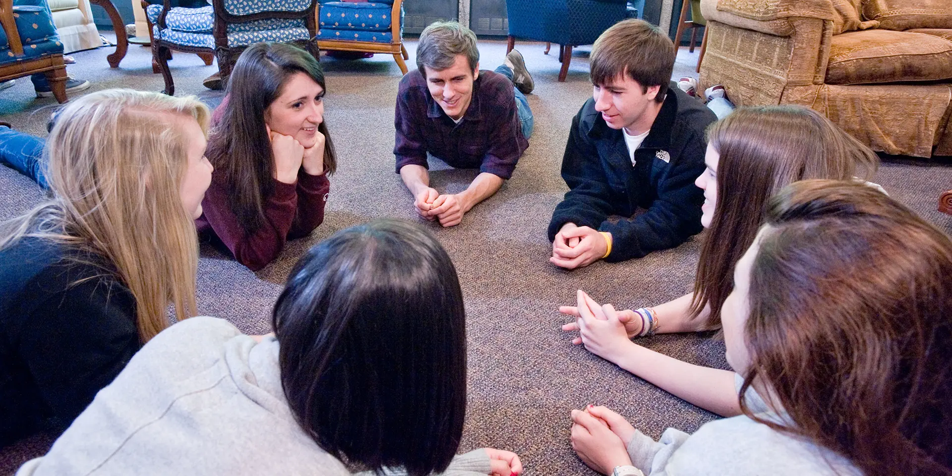Students in circle formation at retreat.