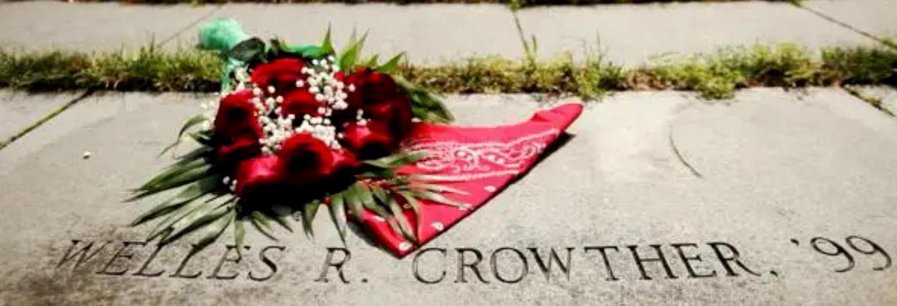 Photo of BC memorial labyrinth with red flowers and red bandanna near Welles R Crowther text