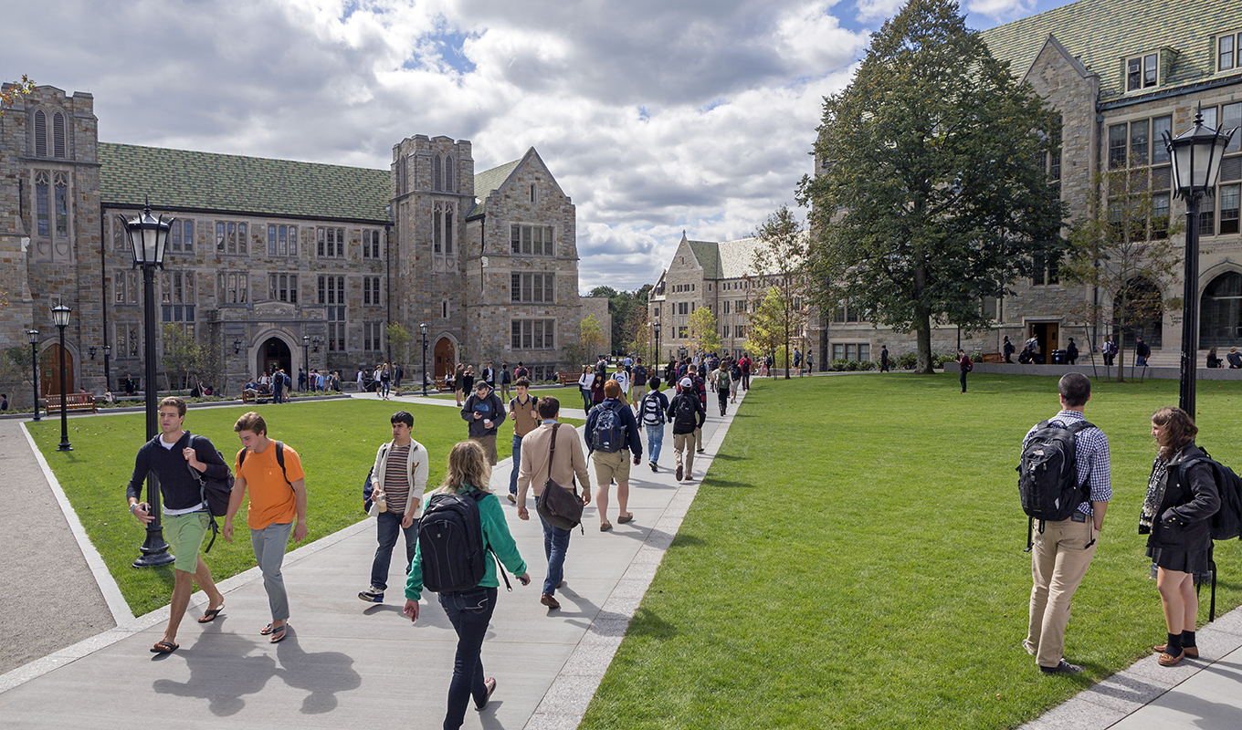 students crossing the quad in front of Fulton