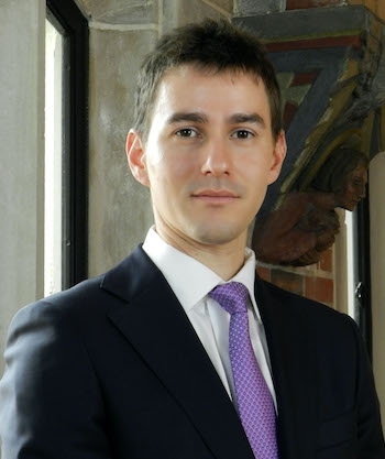 headshot of professor Simcha Barkai in a suit and tie