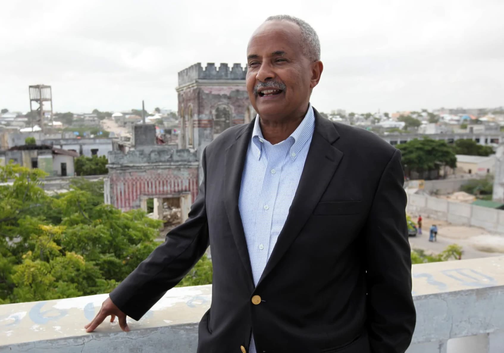 Abdusalam Omer poses on a rooftop