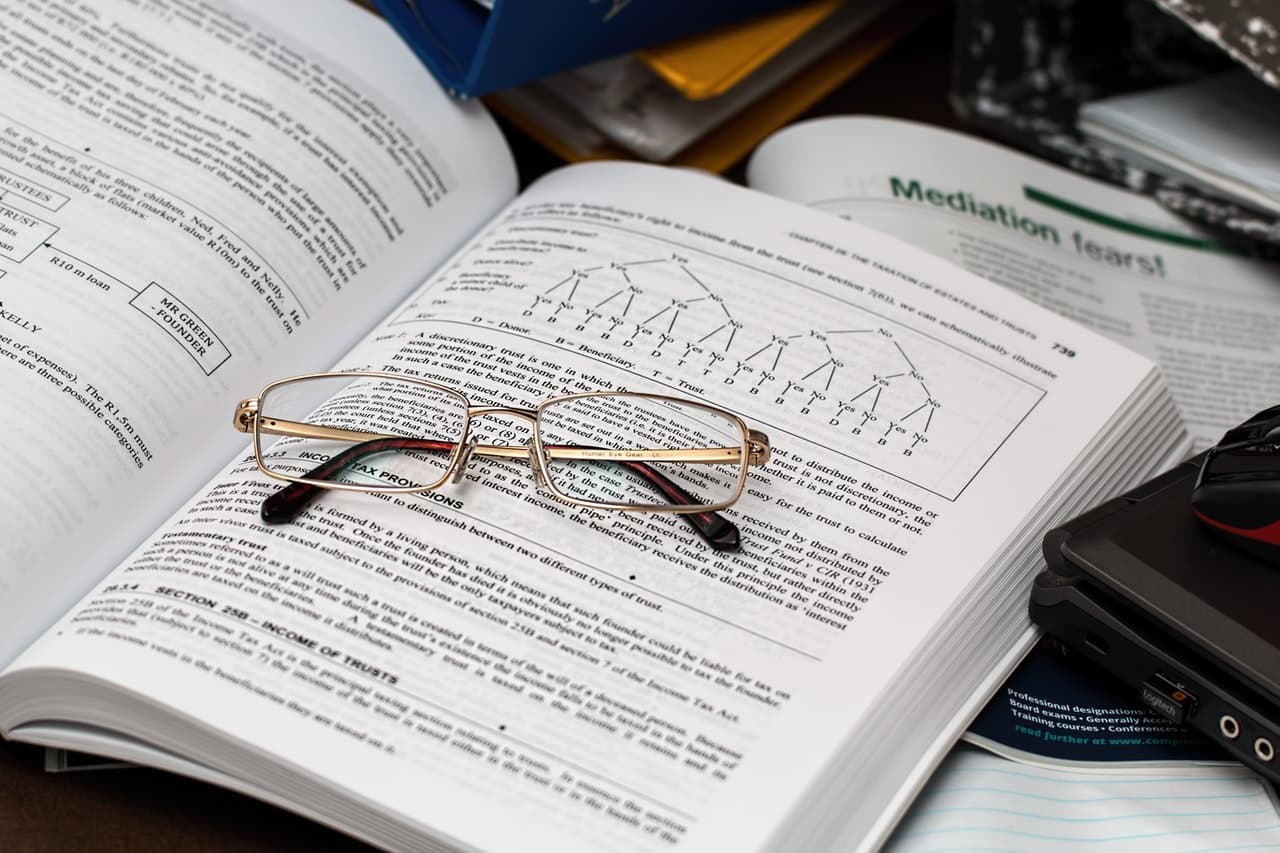 a pair of eyeglasses on an accounting textbook