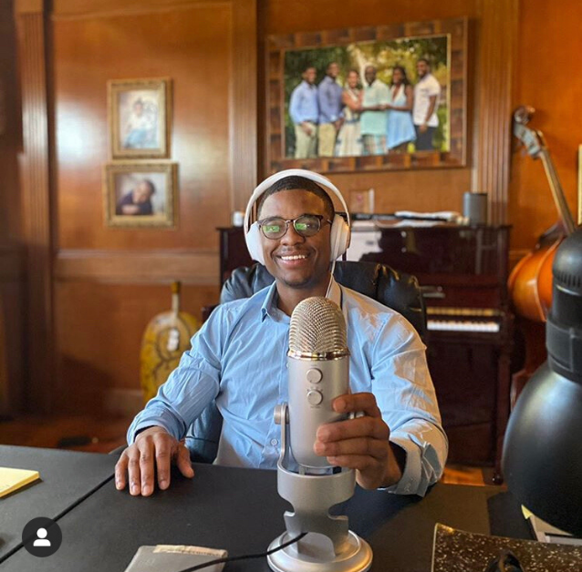 Drew Barksdale '17, Assistant Director, Undergraduate Career Engagement. sitting at his podcast desk