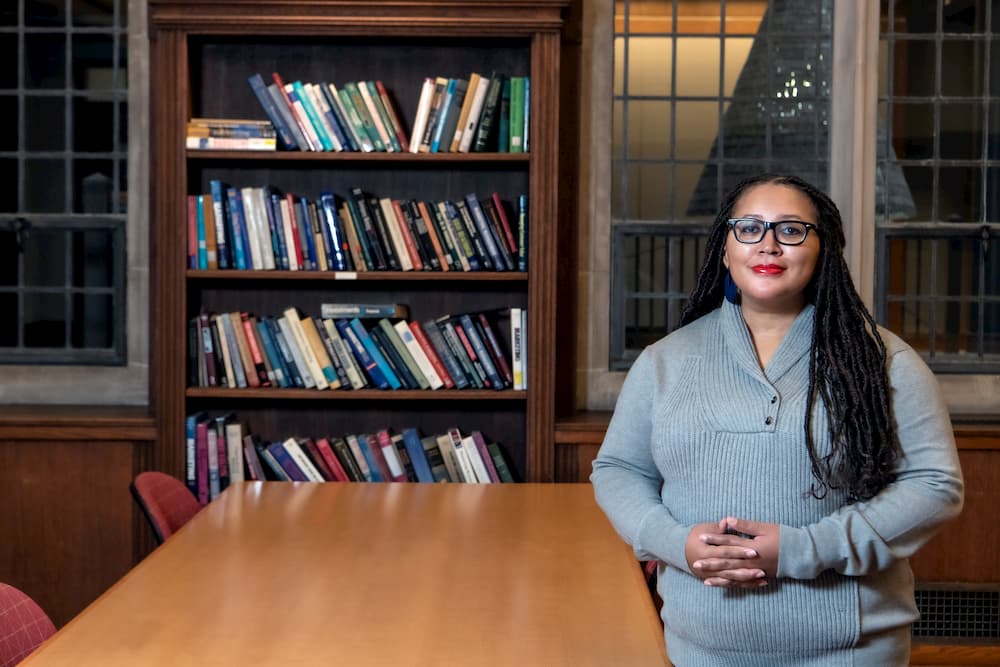 Julia Parker M.B.A. '21, a black woman, in the Fulton Honors Library