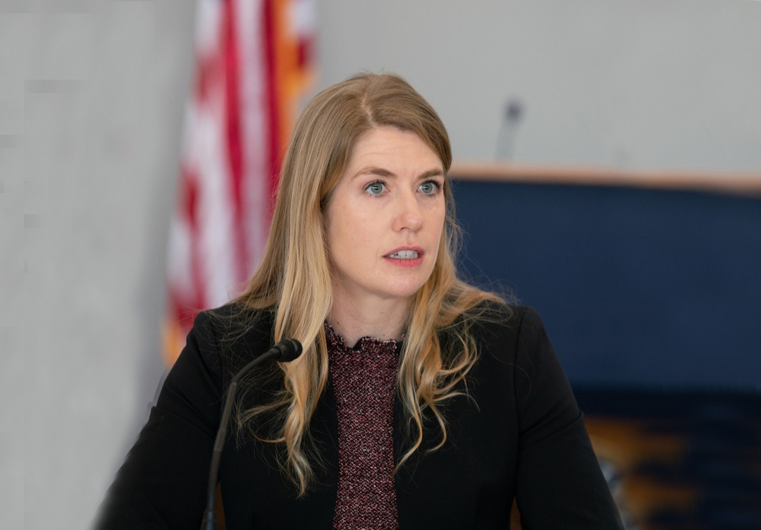 Meghan Stasz, M.B.A. ’10 speaking at a lectern