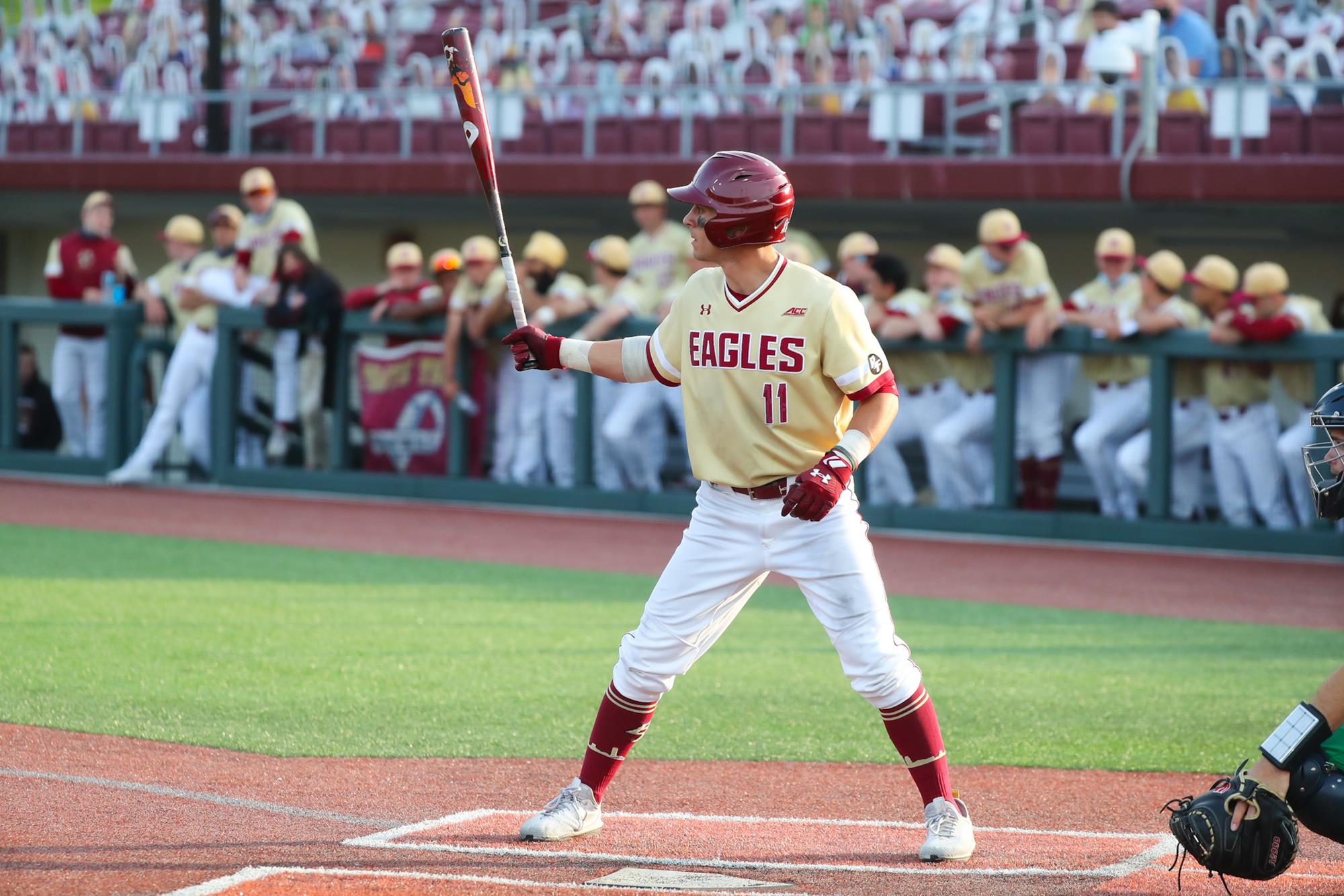 Sal Frelick in a BC Eagles uniform, swinging a baseball bat