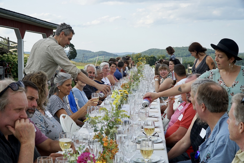 Jake Mazar serving others at a table