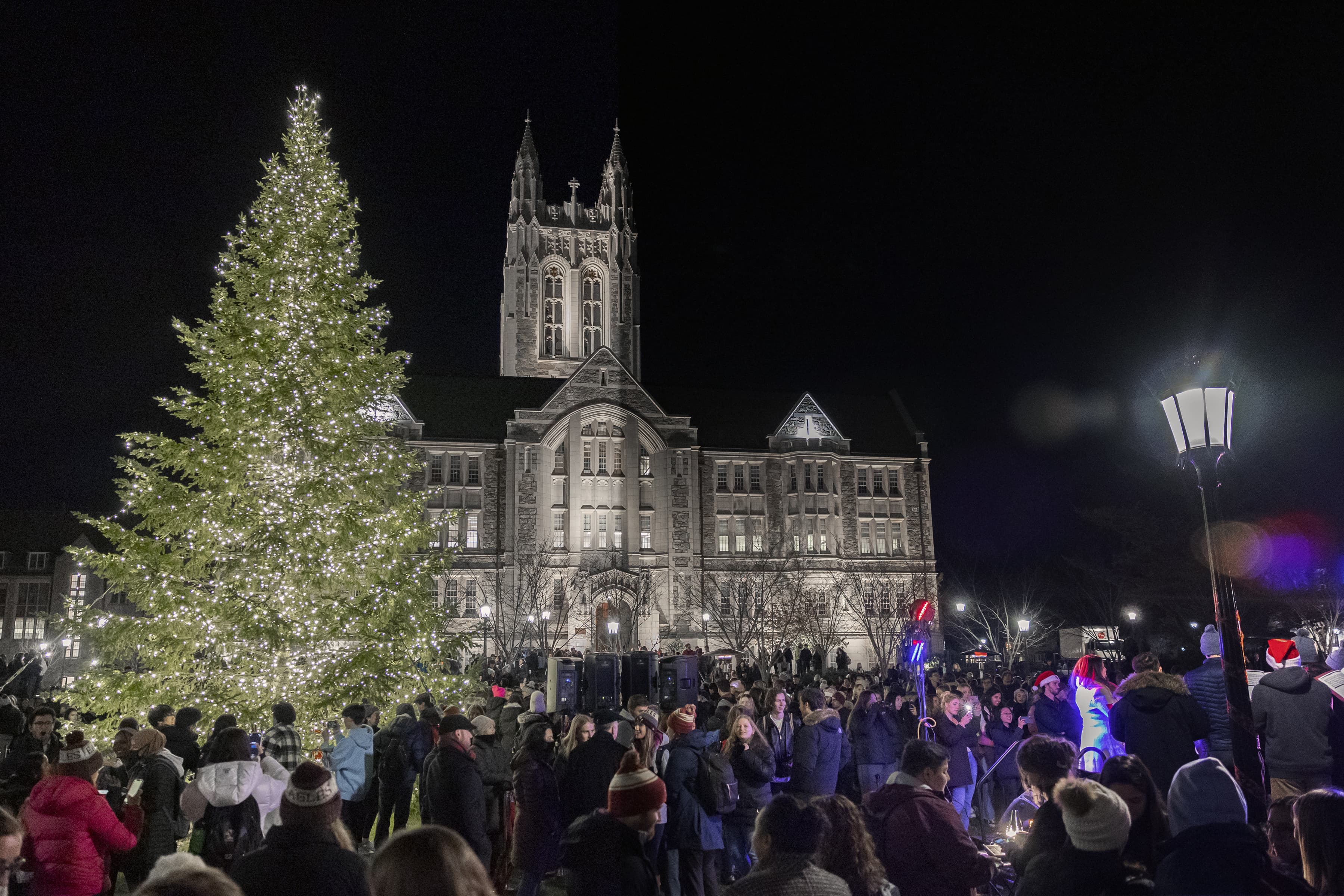 Christmas tree lighting in front of Gasson Hall