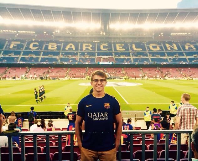 Felipe, Class of 2018 in the stands in a soccer stadium 