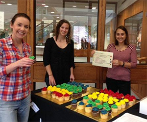 Students at table outside of library