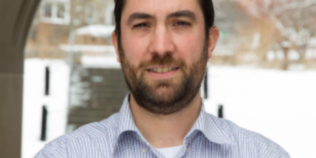 Patrick Conway standing outdoors in a striped shirt, Boston College Lynch Doctoral Candidate and winner of the 2021 Have You Heard Graduate Student Research Contest