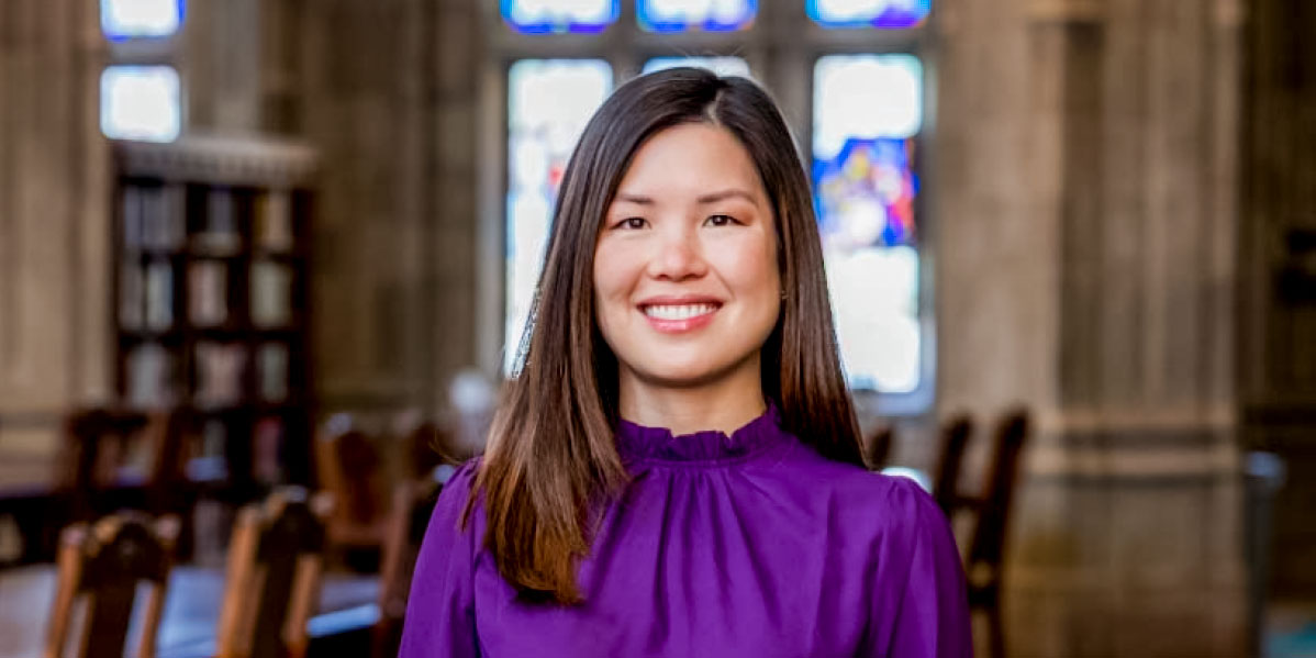 Betty Lai in purple top 