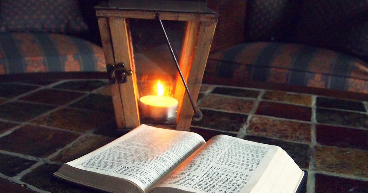 A lantern with a Bible