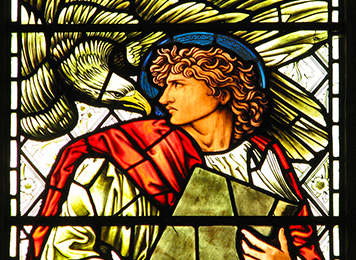 St. John and eagle in stained glass