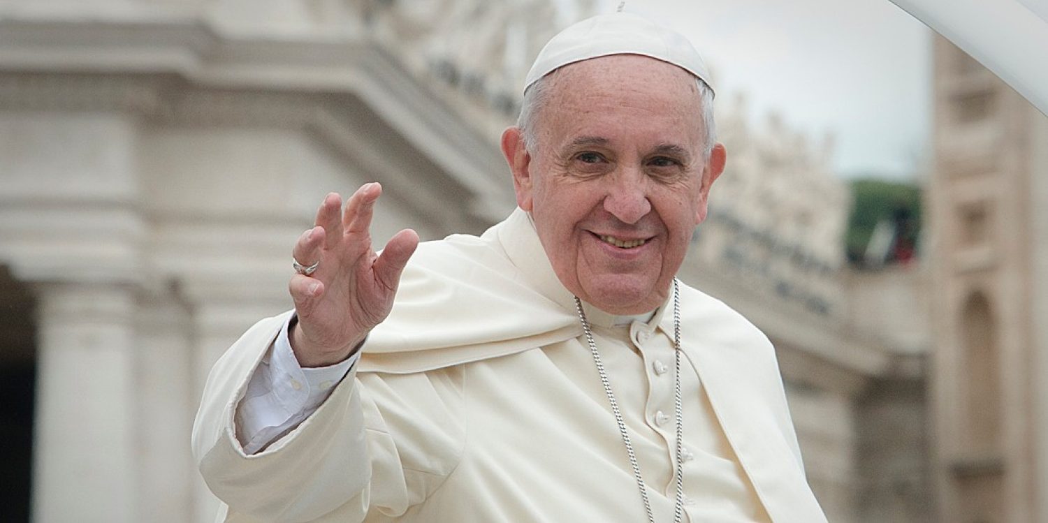 Pope Francis smiling and waving