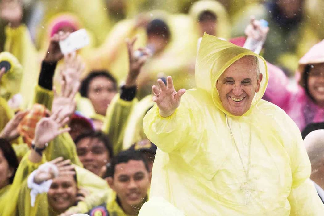 Pope Francis in yellow poncho