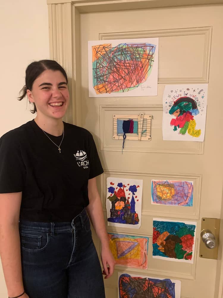 Grace and her door at the CSTM Community House