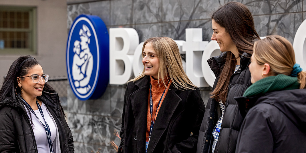 Students chat in front of Boston Children's Hospital