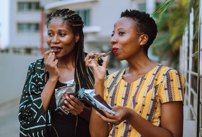 Photo of Priscilla and Kimberly Addison enjoying their chocolates