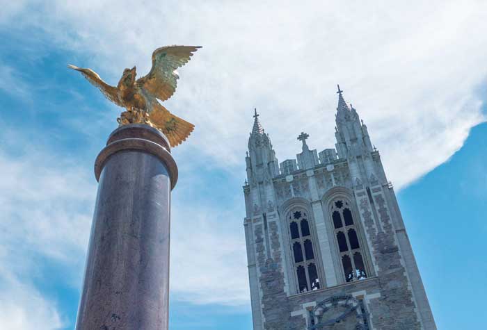 Photo looking up at the eagle and Gasson Hall