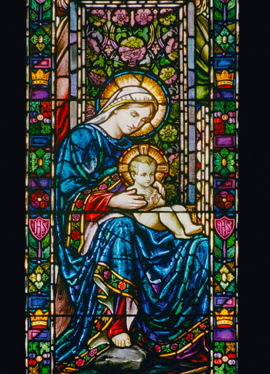 Stained glass image of Mary and child.