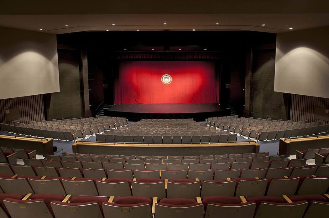 Photos of Robsham Theater Main Stage with the curtain in place containing the university seal displayed. Photographed for Student Affairs website and other uses.